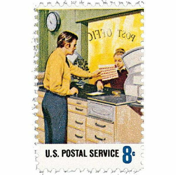 postal service employees with stamps